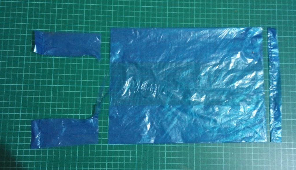 Fold And Flatten A Grocery Bag. Cut The Top And Bottom As Shown In This Picture